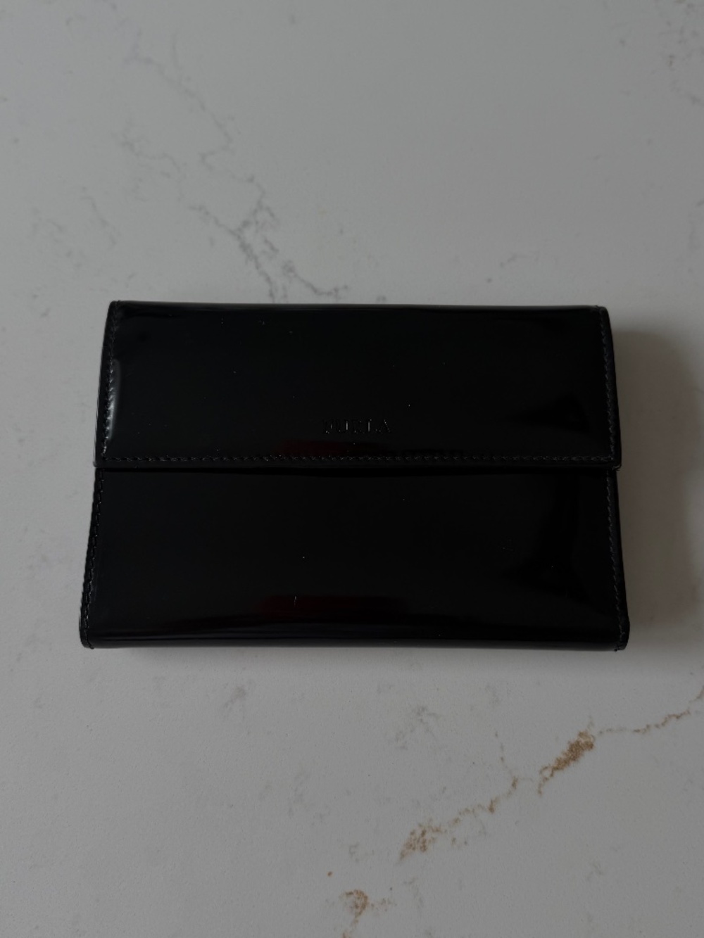 Furla black patent-leather envelope clutch